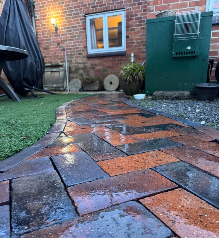 Wet patio with rust and charcoal slate tiles